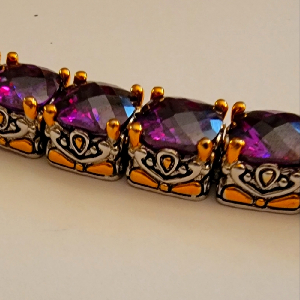 This is a strong sterling silver Size 8.5 rich purple stone bracelet.